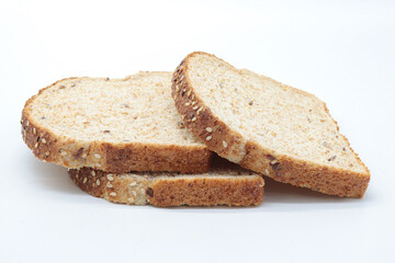 sliced ​​wholemeal bread, on white background. Concept of healthy food, balanced breakfasts, fiber foods.