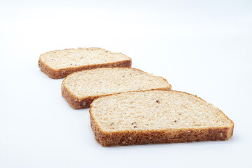 sliced ​​wholemeal bread, on white background. Concept of healthy food, balanced breakfasts, fiber foods.