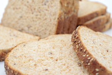Close-up sliced ​​wholemeal bread, on white background
