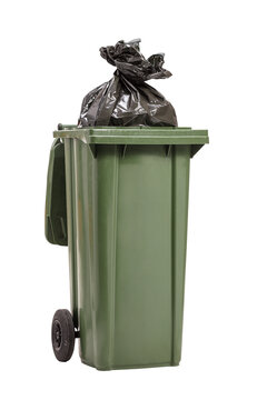 Studio shot of a green waste bin with a plastic bag inside