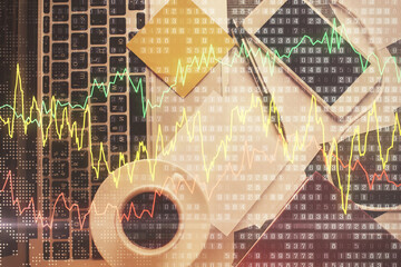 Double exposure of financial chart drawing over table background with computer. Concept of research and analysis. Top view.