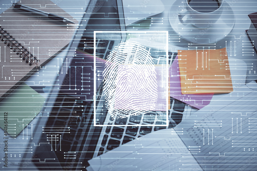 Poster Finger print over computer on the desktop background. Top view. Double exposure. Concept of securitization.
