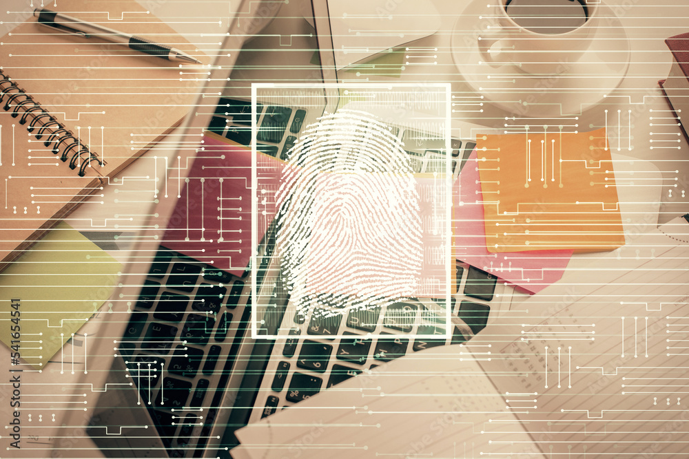 Poster Finger print over computer on the desktop background. Top view. Double exposure. Concept of securitization.