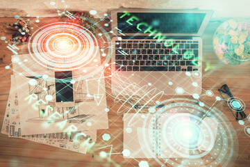 Double exposure of data theme drawing hologram over topview work table background with computer. Concept of technology.