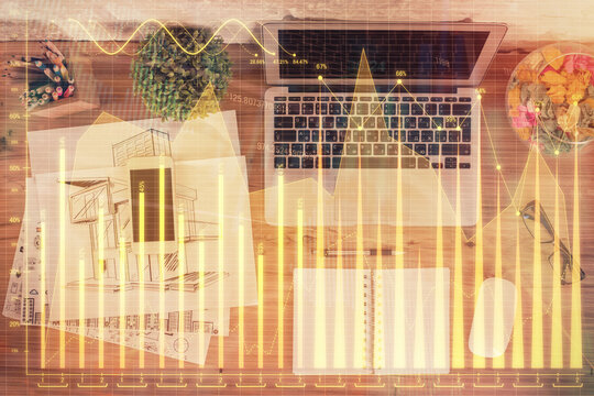 Multi exposure of financial chart drawing over table background with computer. Concept of research. Top view. © peshkova