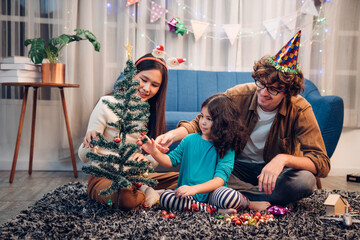 Happy  lovely family father, mother and children celebrate Christmas and new year, light sparklers.