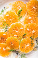 Traditional sicilian italian  vitamin salad with fennel and orange. Fennel and orange citrus salad on the white plate. Raw, vegan cuisine. Winter salad. Texture - obrazy, fototapety, plakaty