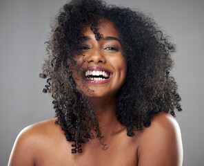 Fototapeta Face, hair care and beauty smile of black woman on gray studio background. Portrait, makeup and female model from Jamaica with beautiful, healthy head of hair and curls after spa cosmetics treatment obraz