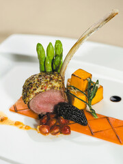 Baked french baby lamb rack with mustard crust, truffle emulsion, shallot balsamic sauce,...