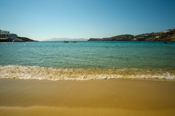 Amazing golden sand and turquoise waters at the popular beach of Mylopotas in Ios Greece