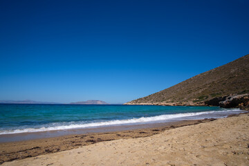 Fototapeta na wymiar The amazing sandy and turquoise beach at Agia Theodoti in Ios Greece