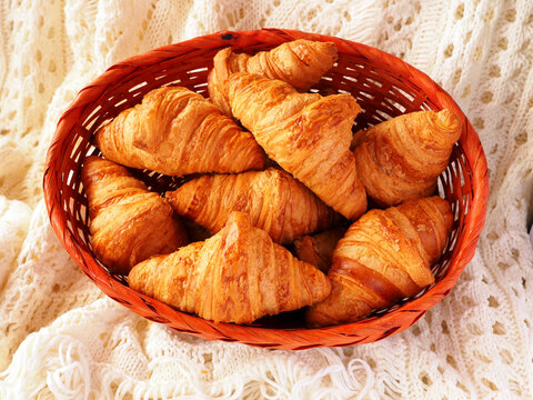 A Few Croissants In A Wicker Basket