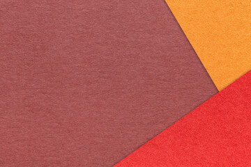 Fototapeta na wymiar Craft wine color paper background with red and orange border. Vintage maroon cardboard. Presentation template