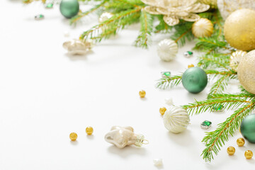Fototapeta na wymiar golden and green christmas decorations on white background