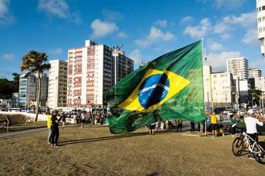 Supporters of the President of Brazil Jair Bolsonaro, protest by placing a large Brazilian flag