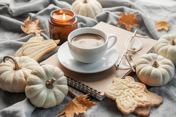 White pumpkins, coffee and autumn leaves