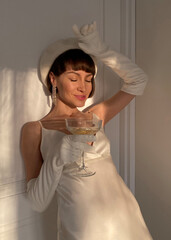 Mobile photo of a young woman with a glass of champagne - 541674711