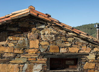 Side facade of a typical portuguese shale house "casa de xisto"