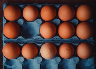 box of eggs photographed of top, it misses an egg
