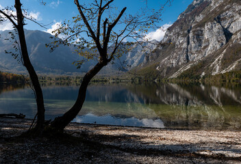 Naklejka na ściany i meble Lake Bohinj and Julian Alps in autumn, Slovenia, reflections in the water