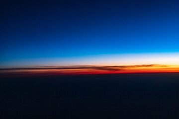 Fototapeta na wymiar The sky from the plane window. Sunset sky from a height