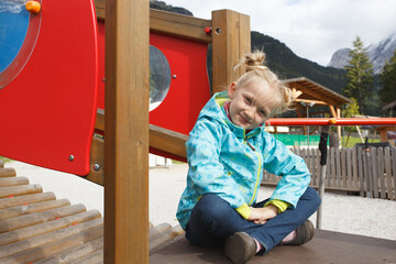 smiling little girl at the playground