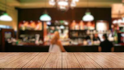 Empty wooden table top with lights bokeh on blur restaurant background.