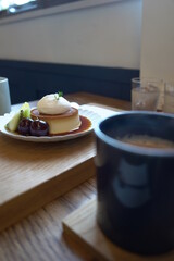 Pudding dessert with a cup of coffee at a cafe