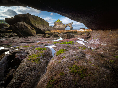 Natural arch and rock formations on Atuh Beach, Nusa Penida island, Bali, Indonesia
