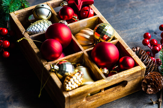 Close-Up of assorted Christmas baubles in a wooden box