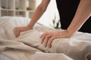 Hands of female healer doing massage