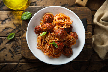 Traditional spaghetti with meatballs and tomato sauce