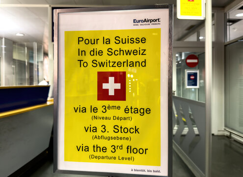 Mulhouse, France - Sept 22, 2022: To Switzerland signage gate entrance in the international Basel Mulhouse Freiburg Airport