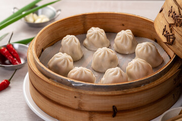 Steamed pork soup dumplings named Xiao long bao in Taiwan.