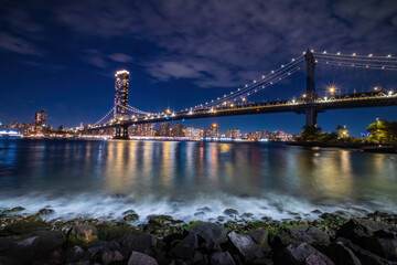 Fototapeta na wymiar View of New York City - beautiful landscape, Manhattan Bridge, waterfront at night over bridge
