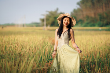 Fototapeta na wymiar girl walking on rice fields