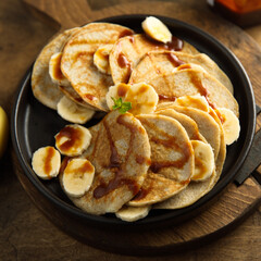 Homemade banana pancakes with caramel sauce