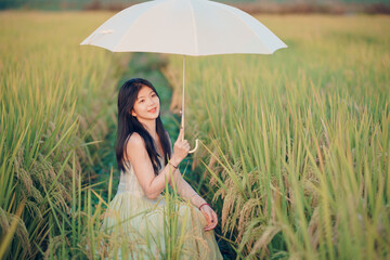 girl walking on rice fields