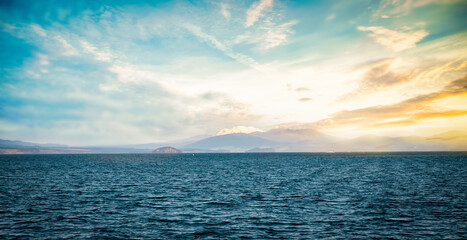 abstract scenic view of blue water and mountains in the background, lake taupo, new zealand. High quality photo