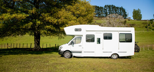 motorhome, caravan or campervan on natural background, vanlife concept, road trip idea. High quality photo