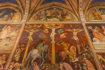 San Gimignano, Italy, 15 April  2022: Beautiful frescoes in the medieval cathedral - obrazy, fototapety, plakaty