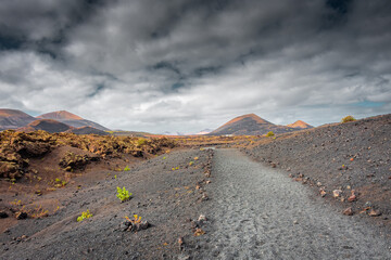 Wild volcanic landscape of Los Volcanes Natural Park in Lanzarote,  Canary Islands, Spain