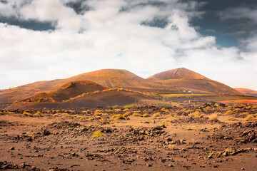 Wild volcanic landscape of Los Volcanes Natural Park in Lanzarote,  Canary Islands, Spain