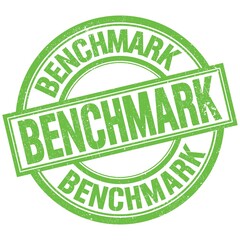 BENCHMARK written word on green stamp sign