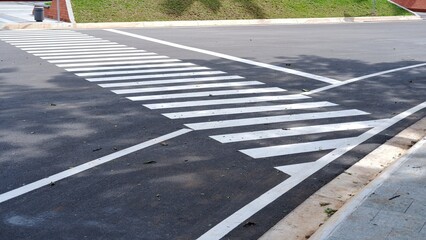 Fototapeta premium Pedestrian crossing, zebra cross, pedestrian cross on asphalt road