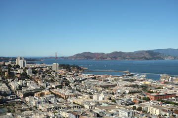 Panoramic scenic aerial view over San Francisco Bay Area with Golden Gate Bridge, downtown skyline cityscape and Alcatraz island sailing boats yachts harbor landmark sights Tower scenery