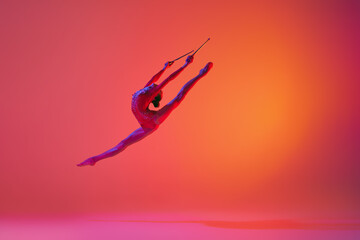 Beautiful and flexible graceful athlete rhythmic gymnastic artist dancing, doing stretch exercises...