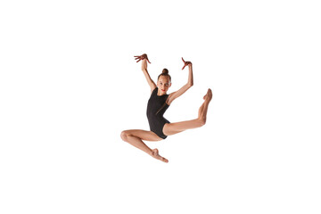 Fototapeta na wymiar Emotions in motion. Portrait of junior gymnast in black sport swimsuit doing gymnastics excercises isolated over white background. Sport, skills, achievements