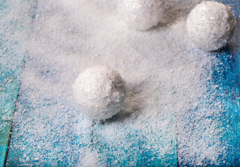 Snow and snowballs on blue boards. Snowballs from snow. new year, background