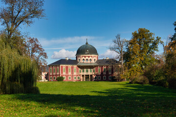 Veltrusy Chateau in autumn sunny day under blue sky. Czech Republic.